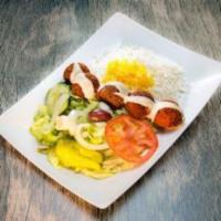 Falafel Entree  · Fried chickpea patties served with tahini sauce basmati rice & small salad. Includes a side ...