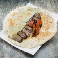 Chenjeh Kabob · Chunks of beef marinated in house seasoning. Choice of topping and choice of side.
