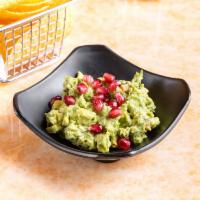 Guacamole Con Granada · Chunky Guacamole topped with fresh pomegranate served with homemade tortilla chips.
