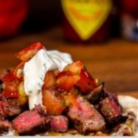 VACA · Grilled marinated tender beef steak with mozzarella cheddar served with pico de gallo and Me...