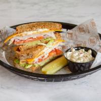 Turkey & Cheddar · Mutigrain bread with lettuce, tomato, onion and mayo. Served with a pickle, chips and choice...
