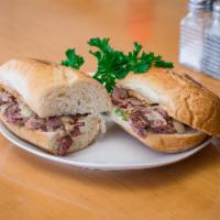 Philly Cheese Steak Sandwich · Fresh thin sliced roast beef, mushrooms, green peppers, onion and provolone cheese.