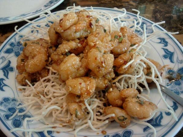 Sesame Shrimp · Shrimp marinated in garlic and wine sauce, sauteed with green onions and sesame seed and underside with rice noodles. Hot and spicy.