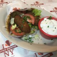 Falafel Sandwich · With lettuce, tomatoes, onions and white sauce on a pita 