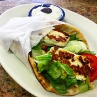 Haloumi Sandwich · Grilled Cypriot goat cheese on a pita with lettuce, tomatoes, tzatziki, and cucumbers
