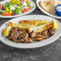 Souvlaki platter · Served with a side salad, one pita bread, one small tzatziki, also your choice of either lem...