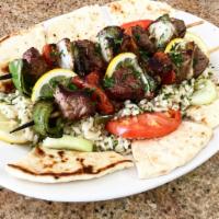 Shish Kabob Platter (beef) · Served with a side salad, one pita bread, one small tzatziki also your choice of lemon potat...