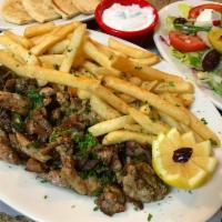 Greek gyro (donner) · Served with salad, pita sauce and choice of potato, rice, fries or peas.