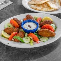 Falafel Plate · Served with salad, pita sauce and choice of potato, rice, fries or peas.