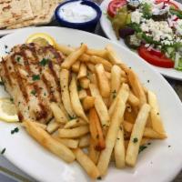 Grilled chicken plate · Grilled chicken breast served with a Greek salad , pita bread ,tzatziki and a choice of Fren...
