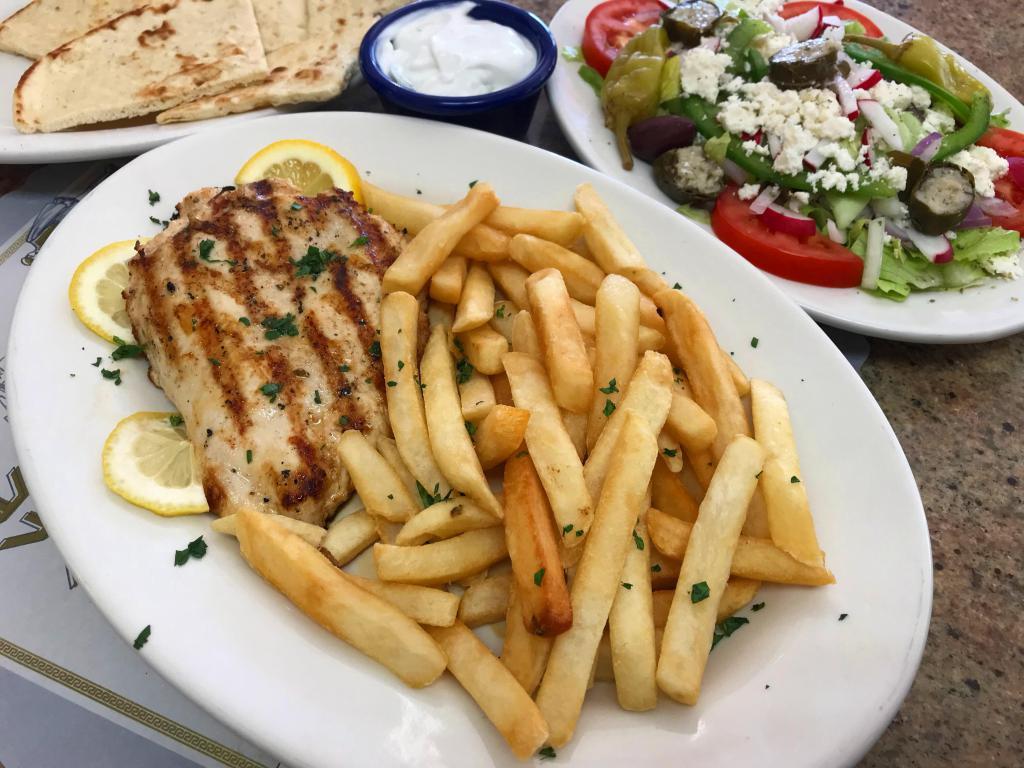 Grilled chicken plate · Grilled chicken breast served with a Greek salad , pita bread ,tzatziki and a choice of French fries ,rice , lemon potatoes or peas