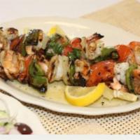 Shrimp Kabob · Served with salad, pita, sauce and choice of potatoes, rice and fries or peas.