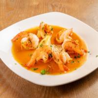 Shrimp Scampi · Tender shrimp broiled in garlic, white wine, lemon and butter sauce.