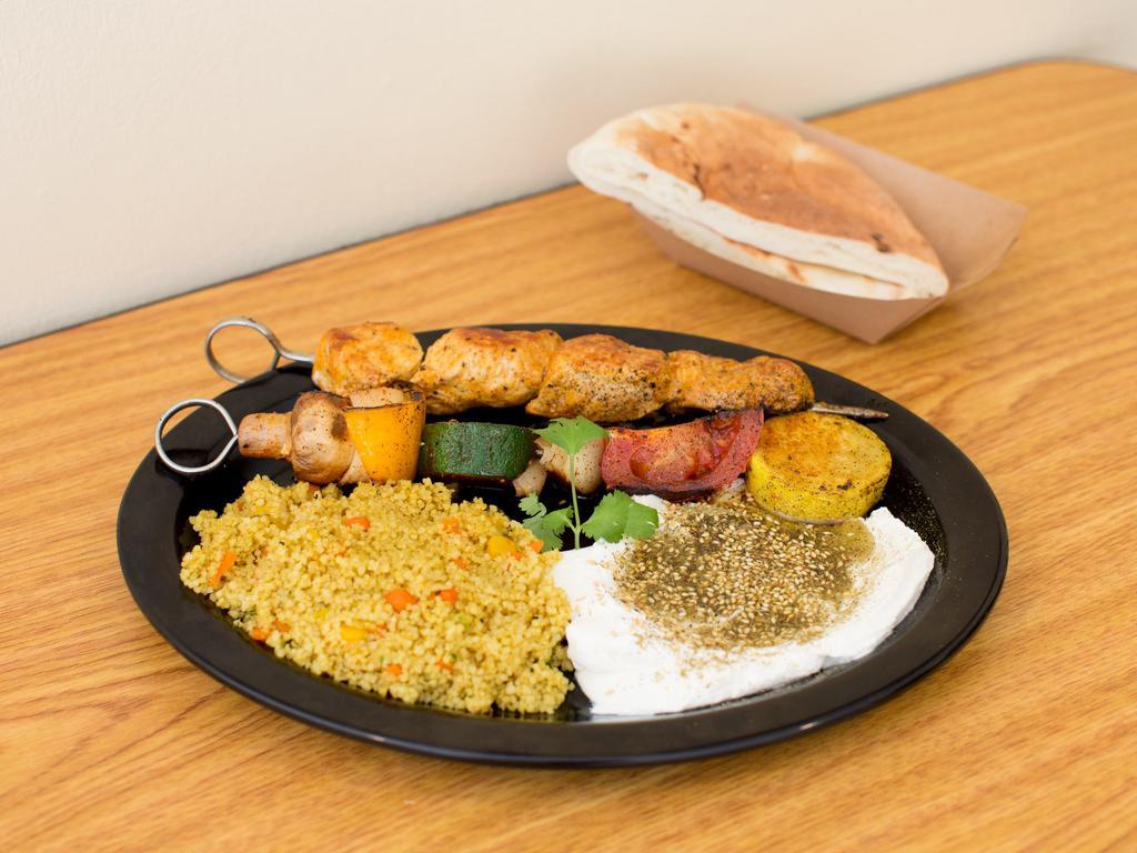 Kebab Plate · Choose 2 kebabs and 2 entree sides. Served with your choice of white, whole wheat, or gluten-free pita. Choose sides labeled vegan or gluten free to modify your plate if desired. Note if you need celiac protocol.