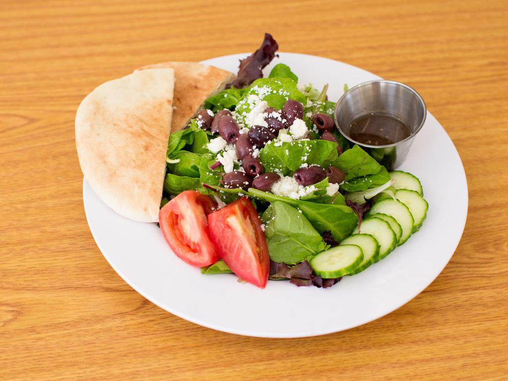 Greek Salad · Mixed greens with feta, Kalamata olives, cucumbers and tomato with pita and housemade balsamic dressing on the side. Can be modified vegan and gluten-free.