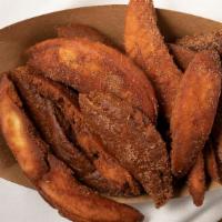 Sweet Chips · Pita strips fried and tossed with cinnamon and sugar. Vegan.