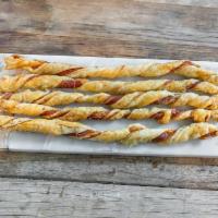 Prosciutto & Cheese Twists · Prosciutto Crudo, Parmesan & Grana Padano Cheeses baked into a Light & Flaky Twist