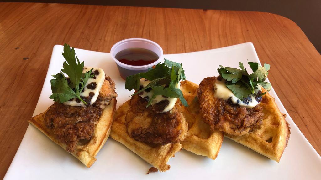 Fried Chicken ＆ Waffles · Fried buttermilk chicken on a Brussels-style waffle. Served with date butter and syrup.