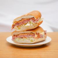Roast Beef Deluxe Sandwich · Bacon, roast beef, melted cheese, lettuce, and tomato.