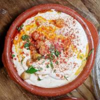 Hummus · Served with whole chickpeas, spices and extra virgin olive oil. Served with Pita Bread. Vegan.