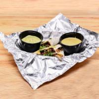 Quesadilla · Flour tortilla filled with cheese and your choice of protein. Comes with 2 sauces for dipping.