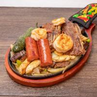 Flores Parrilla  · Beef fajitas, chicken fajitas, beef ribs, sausage, topped with grilled onions, bell peppers ...