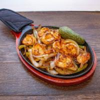 Camarones a la Plancha  · Served with over sauteed onions and bell peppers and guacamole, lettue, pico, charro or re-f...
