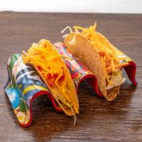 Crunchy crispy taco · Crunchy home add shell taco with ground beef or shredded chicken. Lettuce tomatoes and chedd...