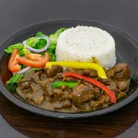 Curry Goat · Curry goat marinated and seasoned serve with white rice, rice & peas, or yellow rice. Steame...
