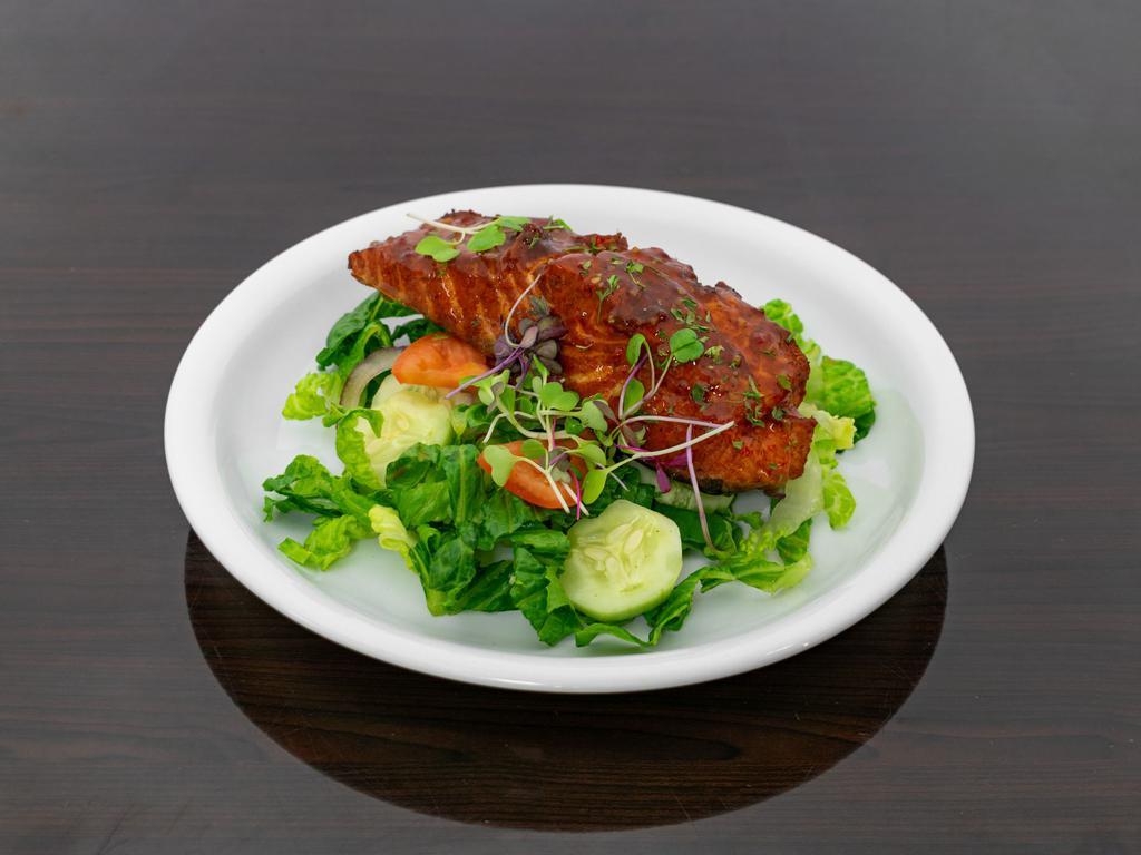 Jerk Salmon Salad · Salad with protein that has been marinated or rubbed with a variety of hot spices.