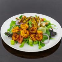 Shrimp and Chicken Salad · Salad with chicken and shrimp that has been cooked in a spicy buttery sauce.