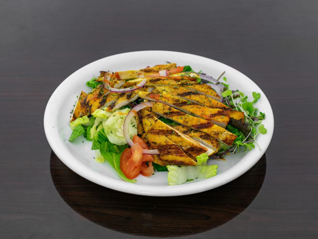 Seasoned Grill chicken salad  · Serve with lettuces and herbs , tomatoes, onion, n more 