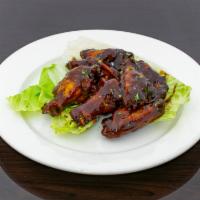Henni Wings  ONLY · Cooked wing of a chicken coated in sauce or seasoning.