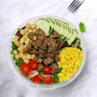 Steak Salad · Organic spring mix, grilled steak, egg, cherry tomato, corn, chickpeas and cucumber.