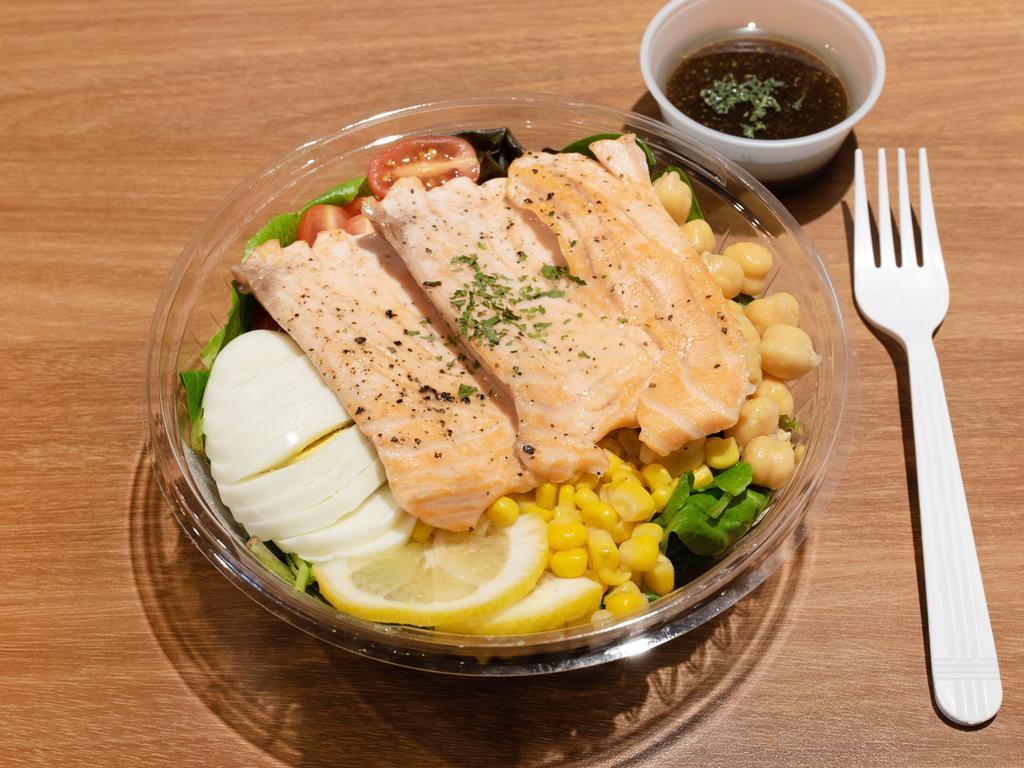 Grilled Salmon Salad · Organic spring mix, grilled salmon, egg, cherry tomato, corn and chickpeas.