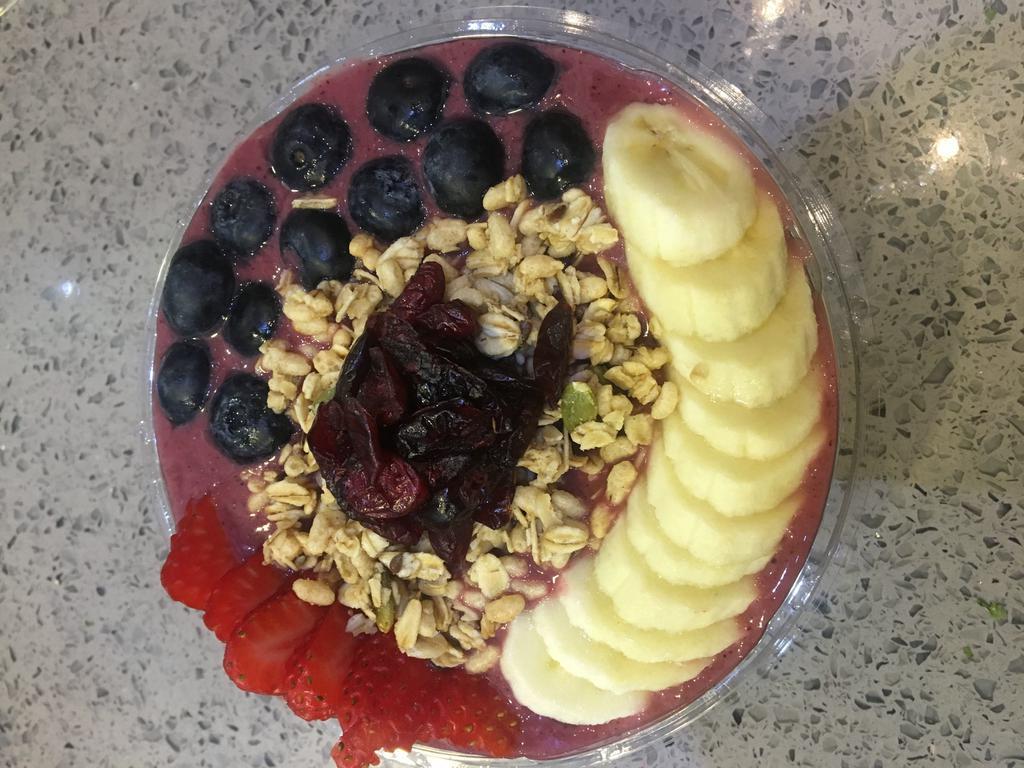 Acai Bowl · blending:organic acai berry,blueberry,strawberry,banana,almond milk.
topping:granola,dried cranberry,banana,blueberry,strawberry.(24 oz)