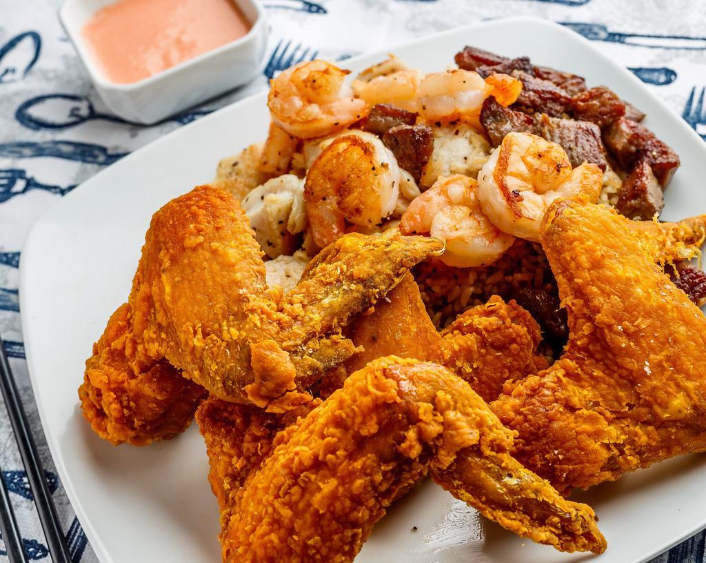 Chicken Wings with Chicken, Steak and Shrimp Fried Rice · 4 pieces whole wings.