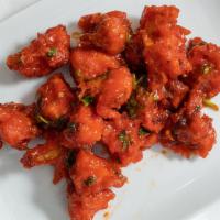 Gobi Manchurian (V) · Cauliflower florets marinated w/ Indian seasoning spices, ginger and garlic paste in thick b...