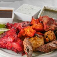 Mixed Grill · Tandoori Chicken, Chicken Tikka, Reshmi Kabab and Lamb Boti Kabab seasoned in Indian herbs &...