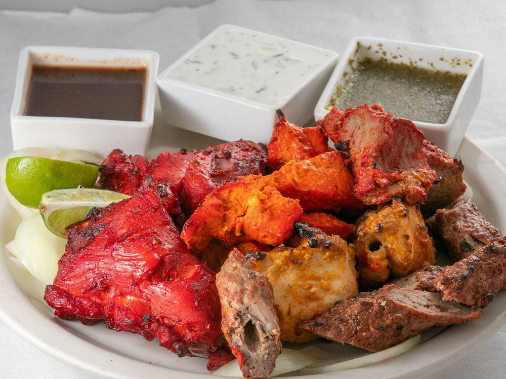 Mixed Grill · Tandoori Chicken, Chicken Tikka, Reshmi Kabab and Lamb Boti Kabab seasoned in Indian herbs & spices & broiled in tandoor. Served with Basmati rice