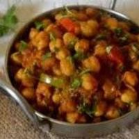 Kadahi Channa (V) · Lightly spiced sauce chick peas cooked with mixed green bellpepper,onion, tomato, and Indian...