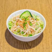 Kani Salad · Crabstick salad with cucumber served over rice, and topped with onion crunchies and scallions.