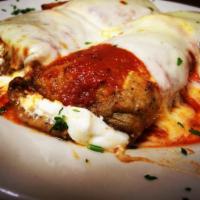 Stuffed Eggplant Rollatini · Served over pasta with bread.