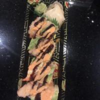 Miles High Club Roll · Spicy tuna inside, topped with shrimp tempura and avocado, spicy mayo and eel sauce.