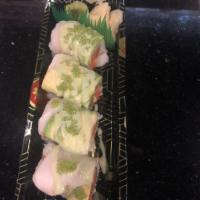 Yoshi Roll · Crunchy spicy tuna inside, topped with white tuna, avocado green tobiko and wasabi mayo.