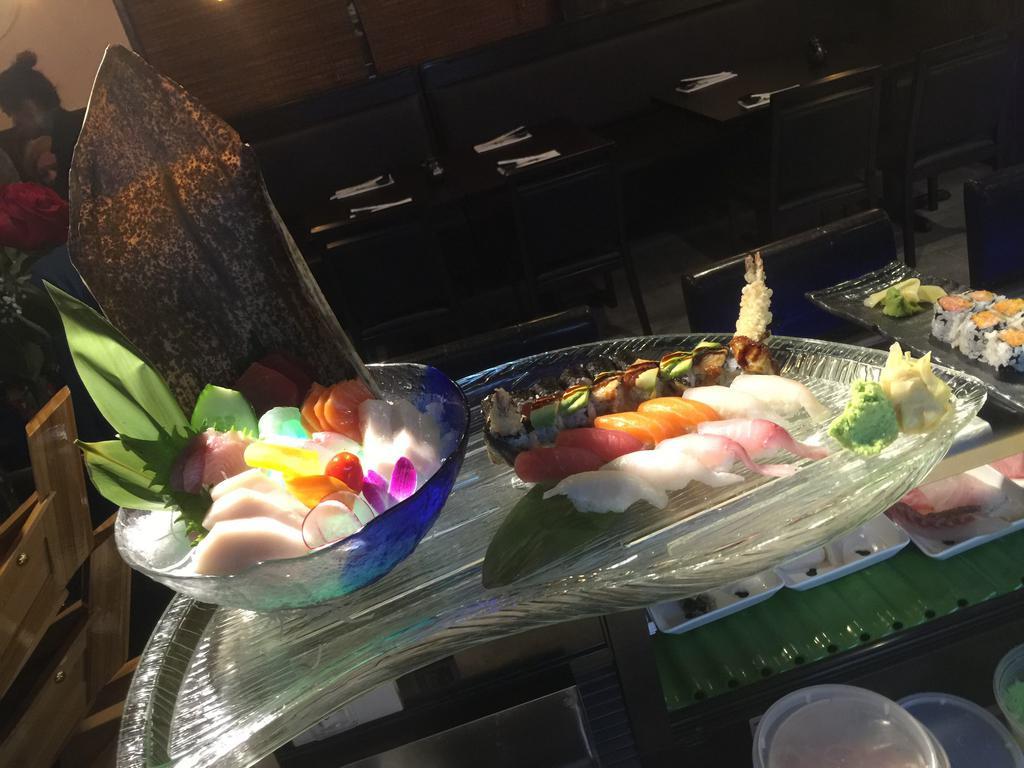 Sushi Sashimi for Two · 18 piece sashimi, 10 piece sushi, 1 of tuna roll and chef special roll.