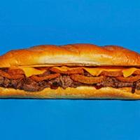 BBQ Cheesesteak · Sliced steak with melted cheddar, fried onion rings, and tangy BBQ sauce on a hoagie roll.