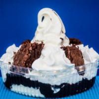Hot Fudge Brownie · Brownie topped with vanilla ice cream, hot fudge, whipped cream, and nuts.
