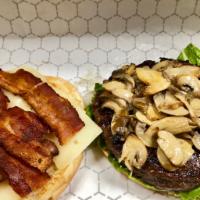 The Ray Burger · Topped with Swiss cheese,  bacon, lettuce and mushroom