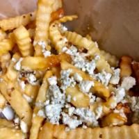 Garlic Bleu Cheese Fries · Topped with crumbled blue cheese and garlic.
